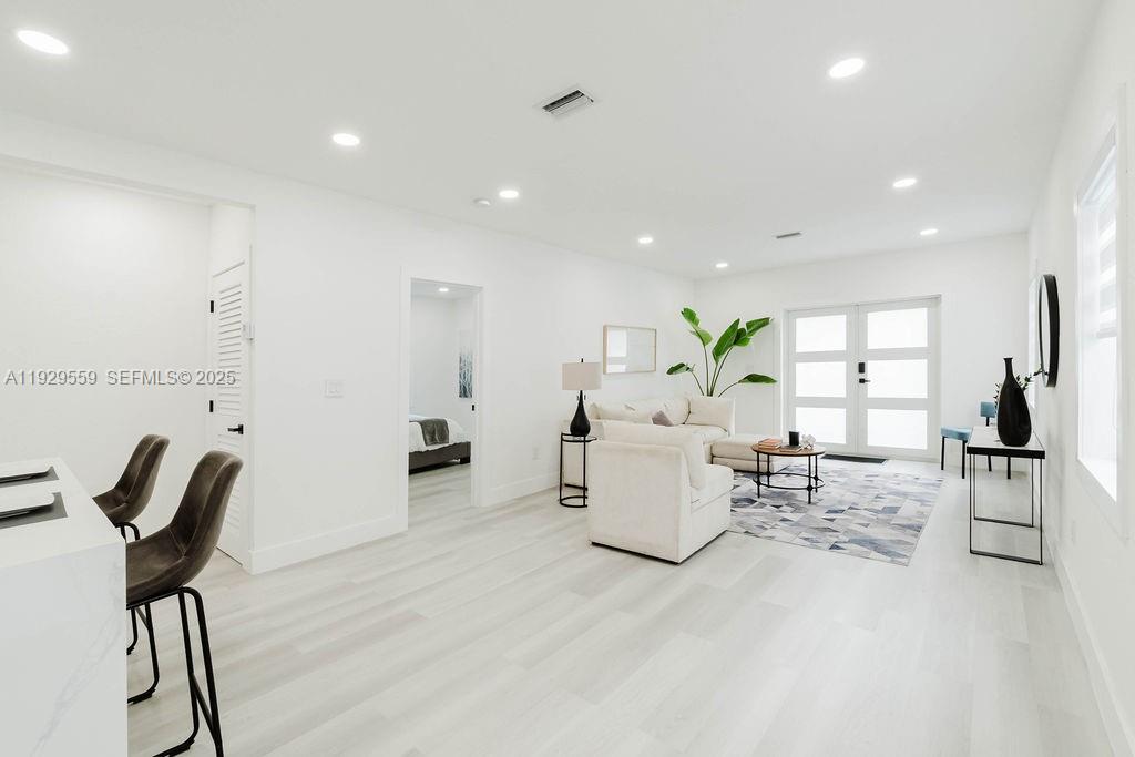 2101 Southwest 16th Terrace Miami, FL 33145 - Photo 31 of 55 a living room with furniture and a table