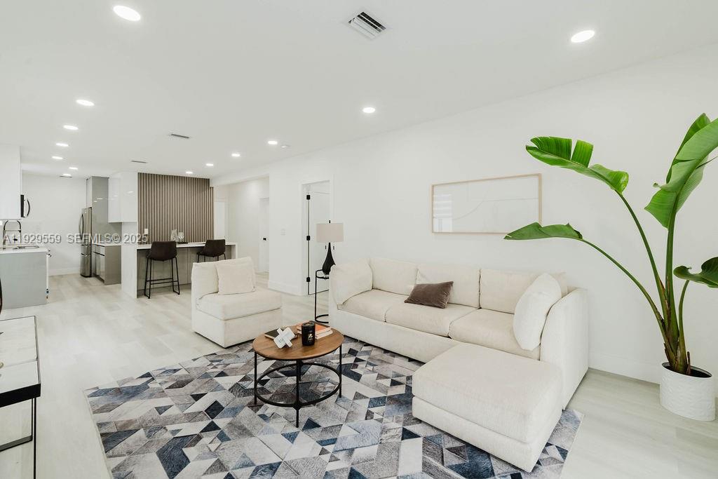 2101 Southwest 16th Terrace Miami, FL 33145 - Photo 33 of 55 a living room with furniture and a potted plant