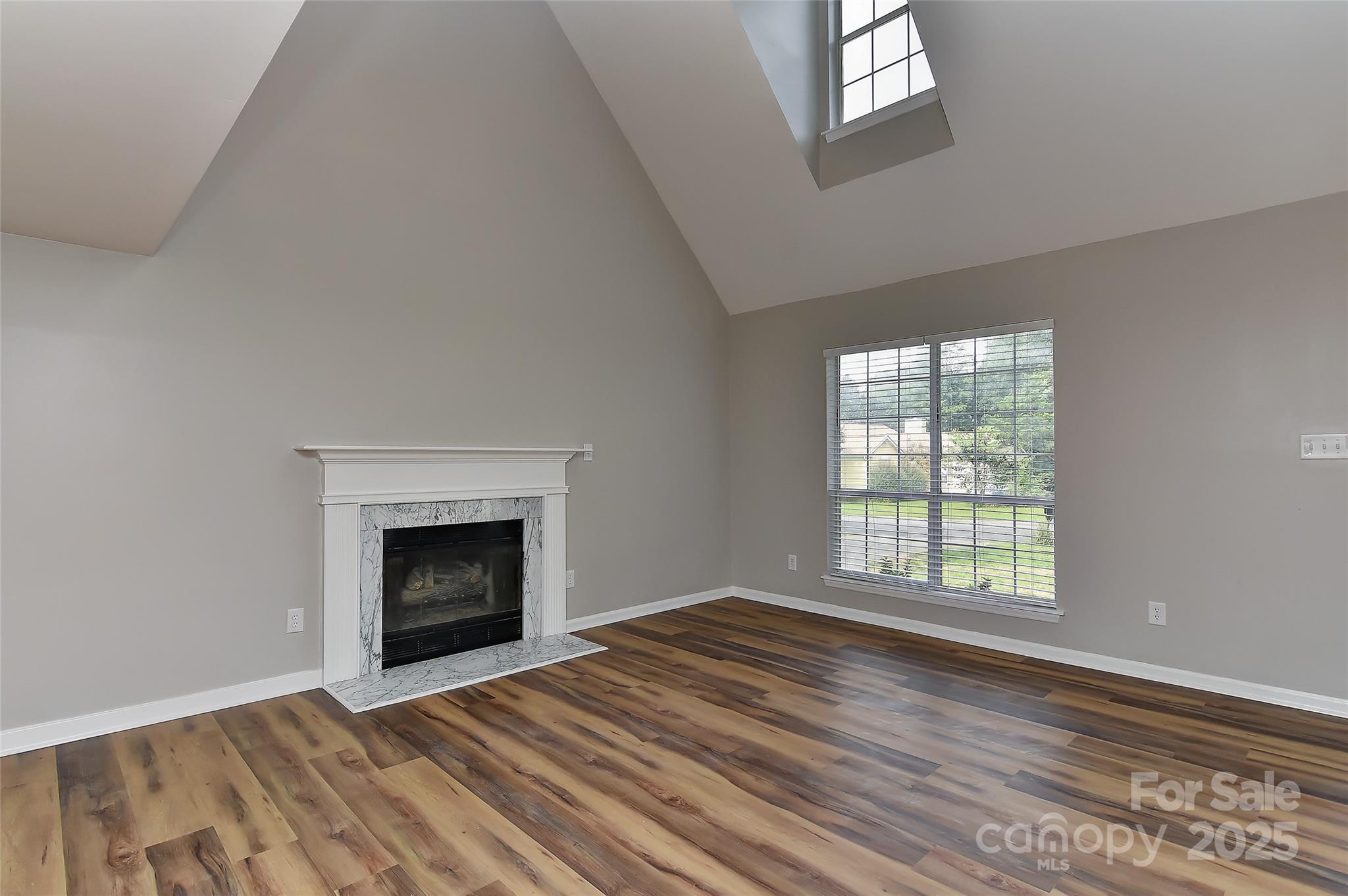 8056 Hunley Ridge Road Matthews, NC 28104 - Photo 17 of 37 an empty room with windows and fireplace
