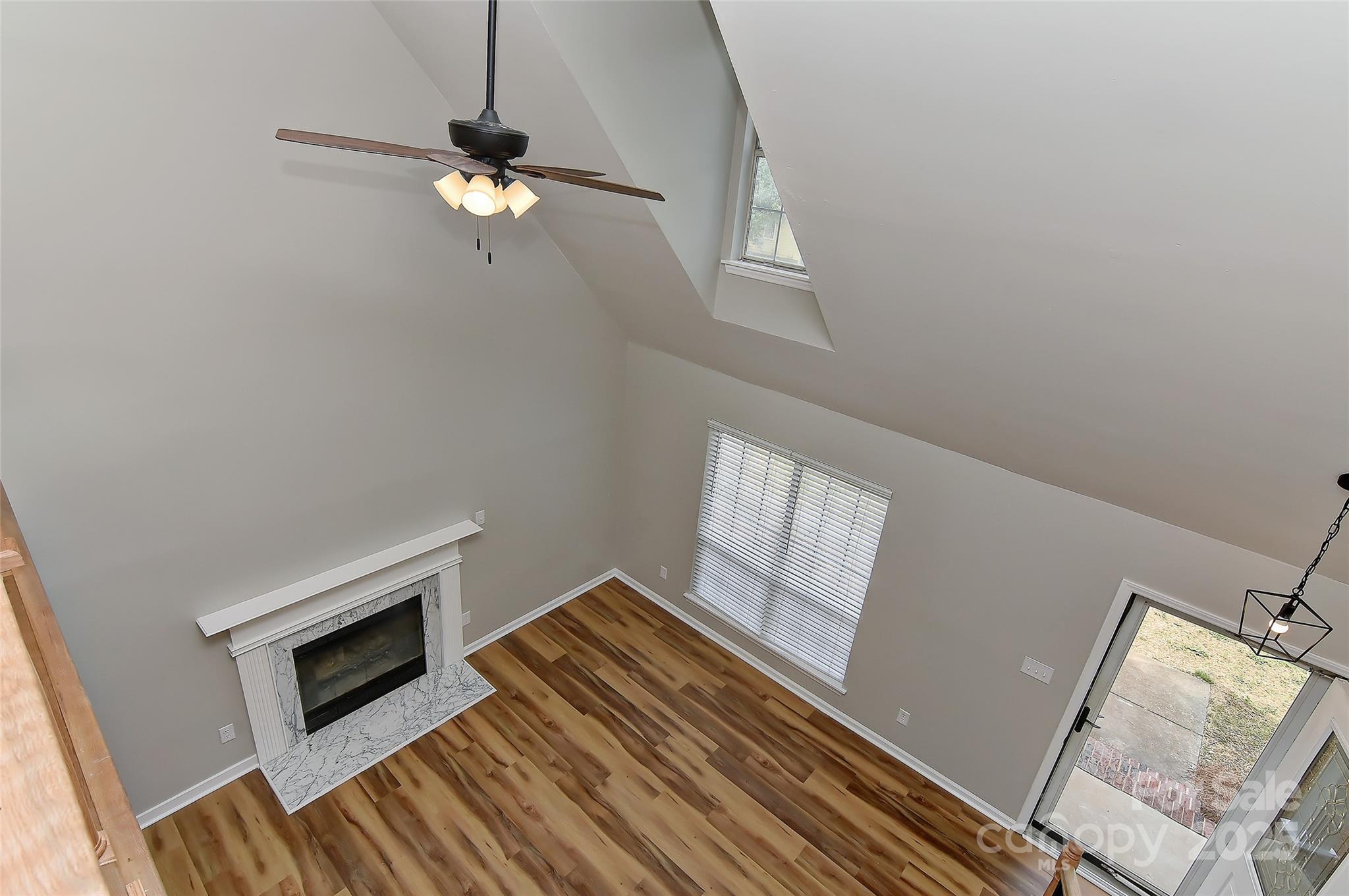 8056 Hunley Ridge Road Matthews, NC 28104 - Photo 18 of 37 a bedroom with a bed and a fireplace