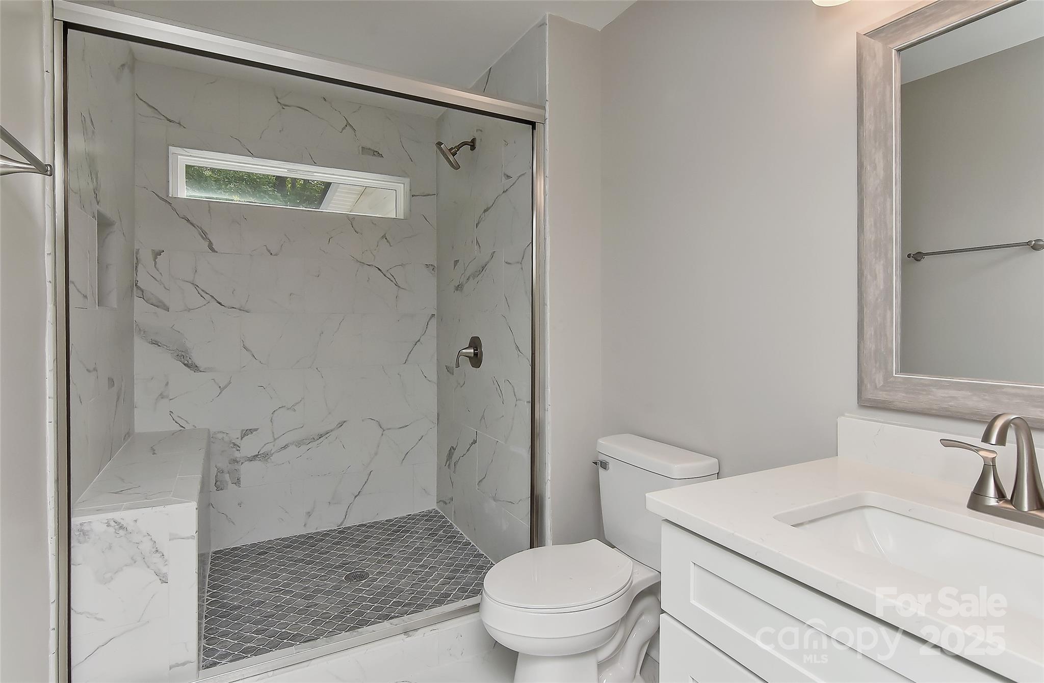 8056 Hunley Ridge Road Matthews, NC 28104 - Photo 21 of 37 a bathroom with a granite countertop sink toilet and shower
