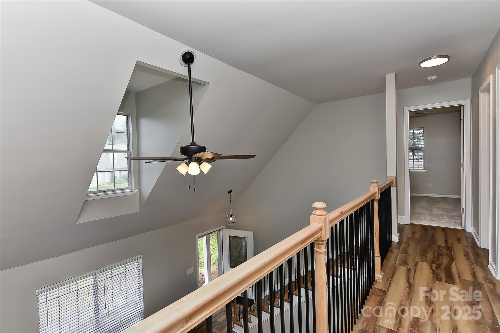 8056 Hunley Ridge Road Matthews, NC 28104 - Photo 30 of 37 a view of a hallway to a chandelier