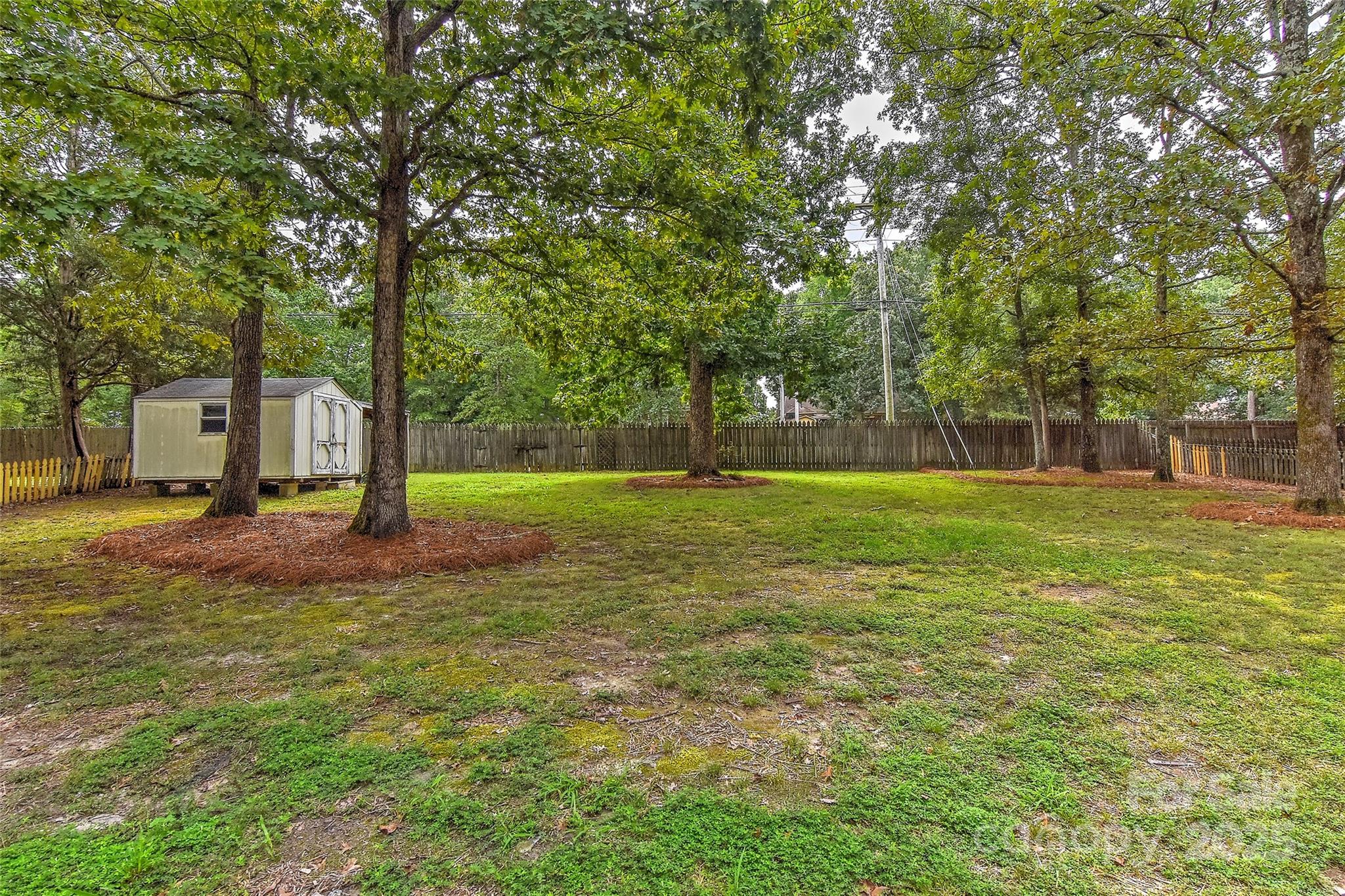 8056 Hunley Ridge Road Matthews, NC 28104 - Photo 35 of 37 a view of a park with large trees