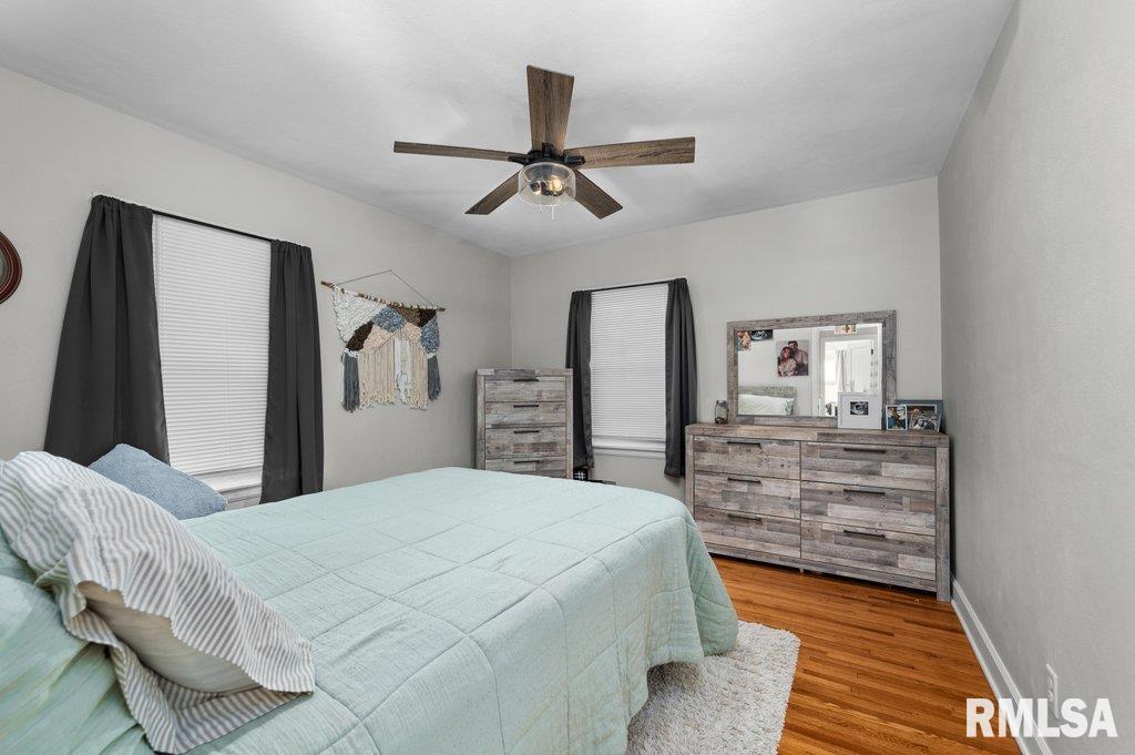 2133 Warren Street Davenport, IA 52804 - Photo 12 of 26 a bedroom with a bed and a dresser