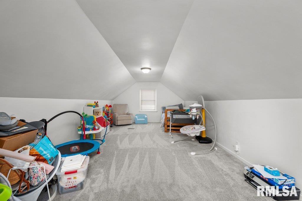 2133 Warren Street Davenport, IA 52804 - Photo 18 of 26 a bedroom with furniture and a gym equipment