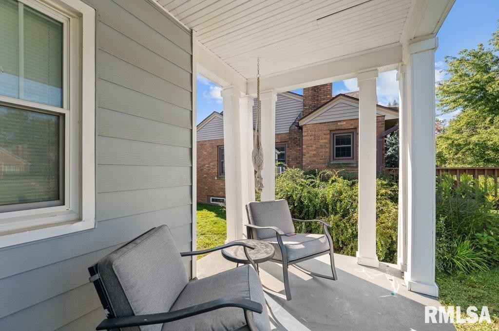 2133 Warren Street Davenport, IA 52804 - Photo 21 of 26 a view of a house with backyard sitting area and garden