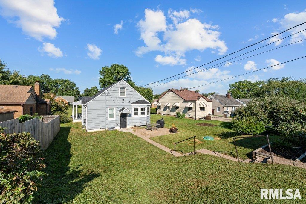 2133 Warren Street Davenport, IA 52804 - Photo 26 of 26 a view of a house with a big yard and large tree