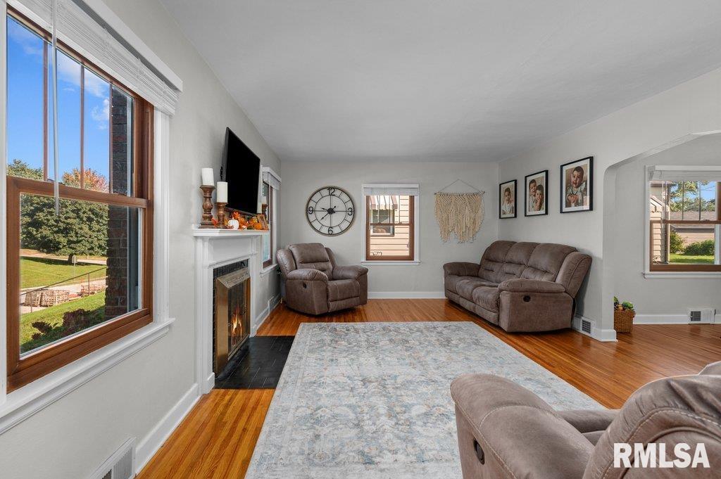 2133 Warren Street Davenport, IA 52804 - Photo 5 of 26 a living room with furniture and a fireplace