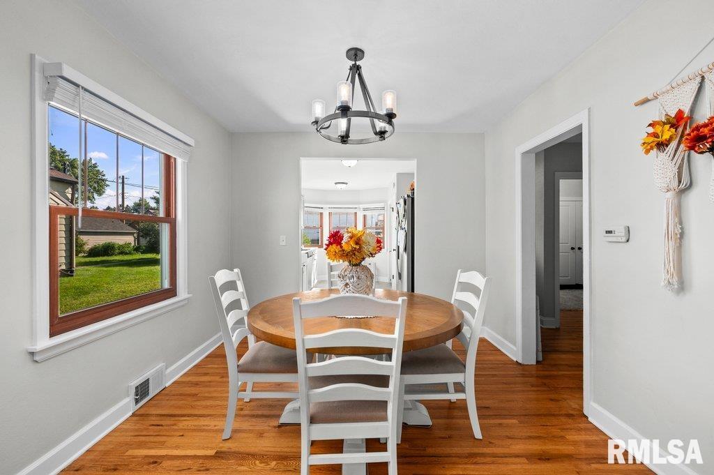2133 Warren Street Davenport, IA 52804 - Photo 8 of 26 a view of a dining room with furniture wooden floor and window