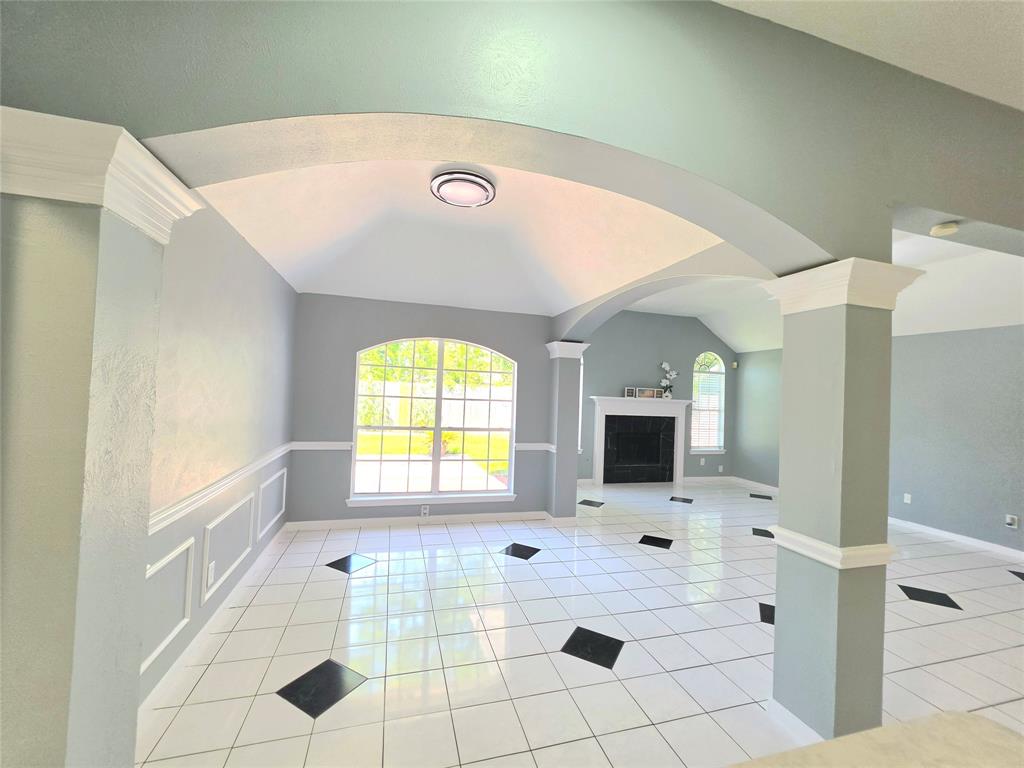 13618 Sablegrove Lane Houston, TX 77014 - Photo 10 of 30 a view of open kitchen with a sink and a fireplace