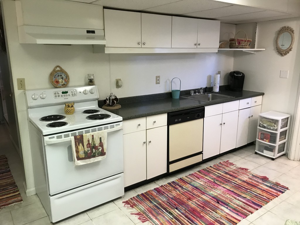 192 Morrison Road Taunton, MA 02718 - Photo 11 of 21 a kitchen with white cabinets and white appliances