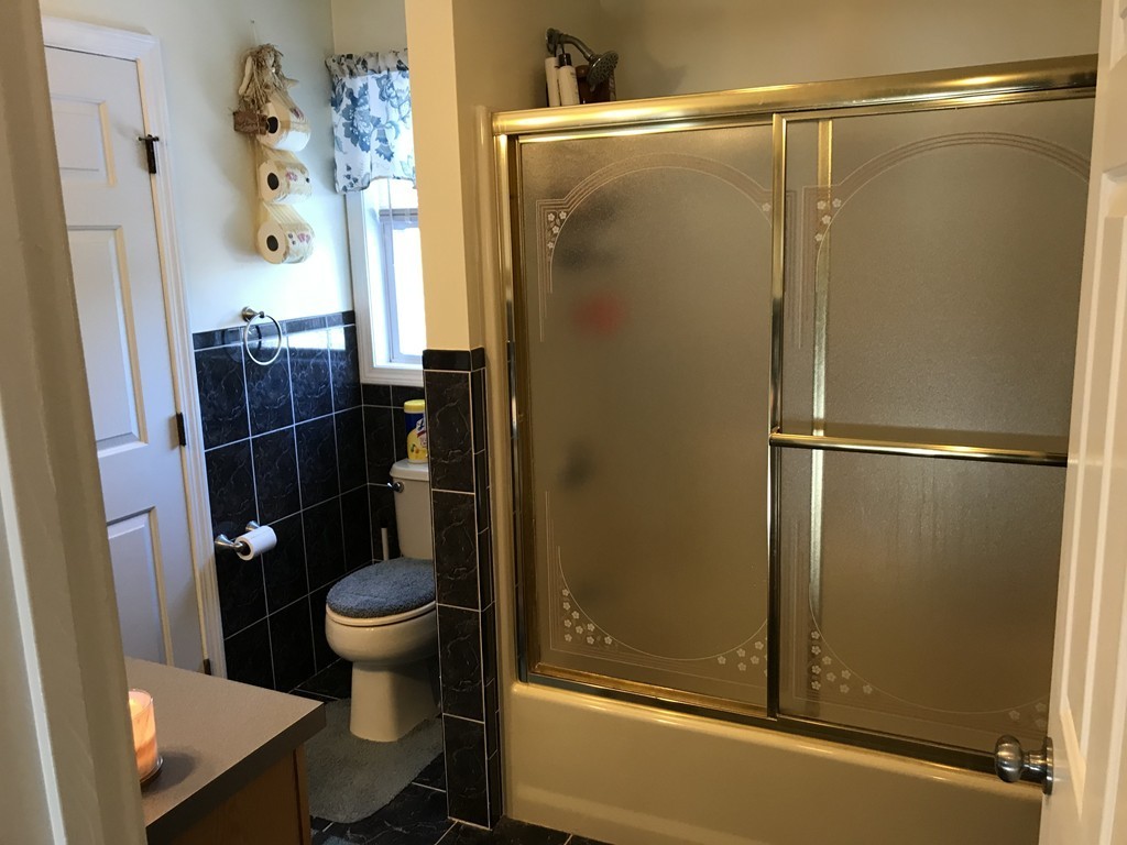 192 Morrison Road Taunton, MA 02718 - Photo 12 of 21 a bathroom with a shower a toilet and sink