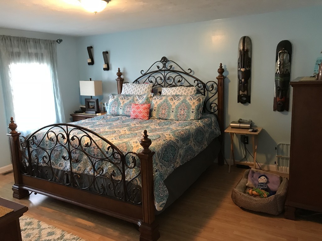 192 Morrison Road Taunton, MA 02718 - Photo 8 of 21 a bedroom with a bed and a tv on the dresser