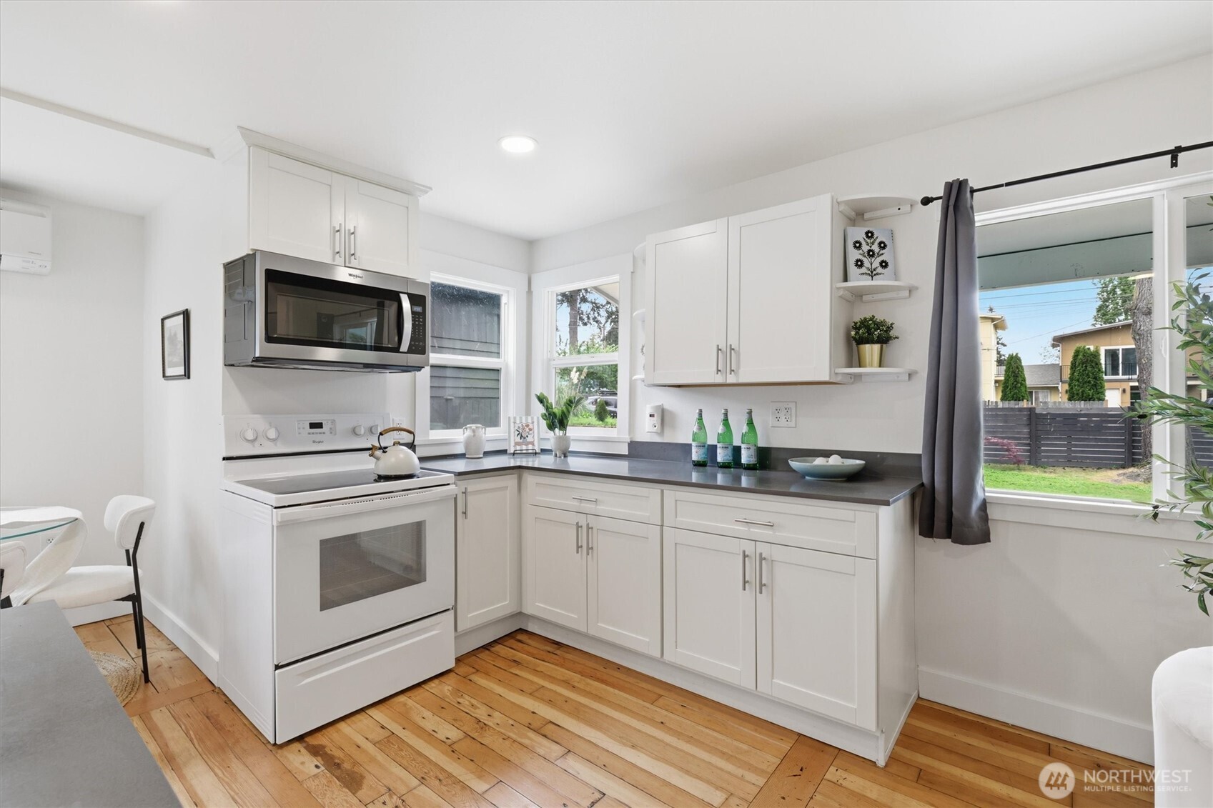 1651 Southwest 114th Street Seattle, WA 98146 - Photo 13 of 37 a kitchen with a sink stove and microwave