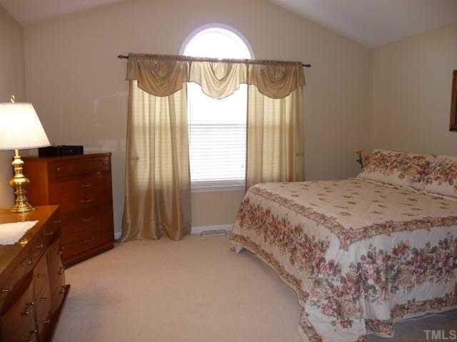 49 River Ridge Way Willow Spring, NC 27592 - Photo 8 of 12 Master Bedroom with palladium window