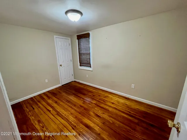 a view of a kitchen with furniture and a ceiling fan