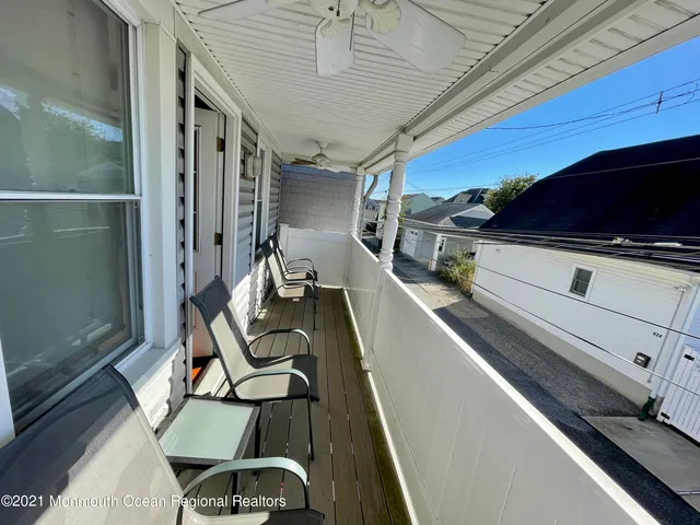 a backyard of a house with yard and outdoor seating