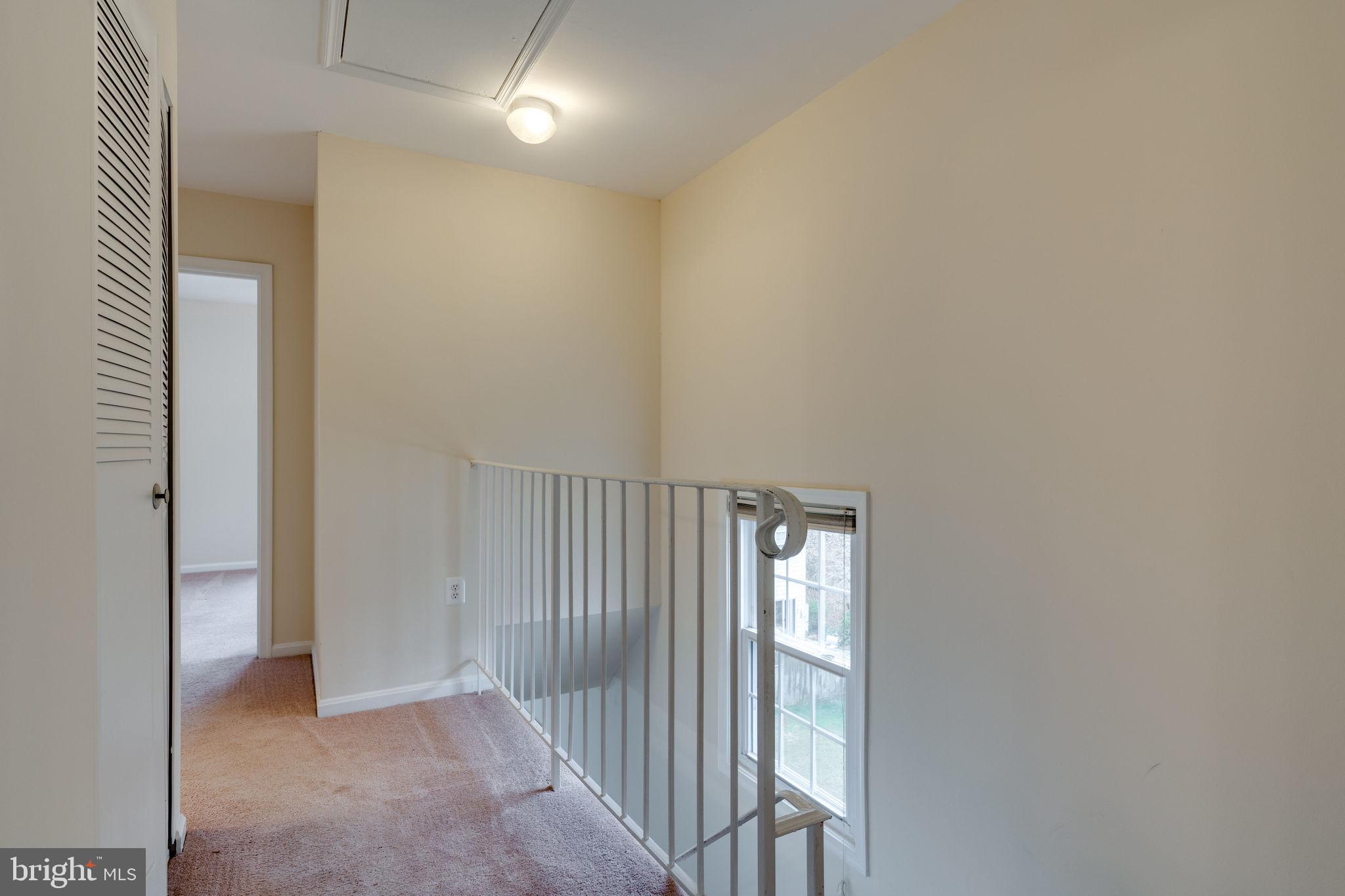 6032 Selwood Place Springfield, VA 22152 - Photo 27 of 42 Bedroom level hallway is bright.