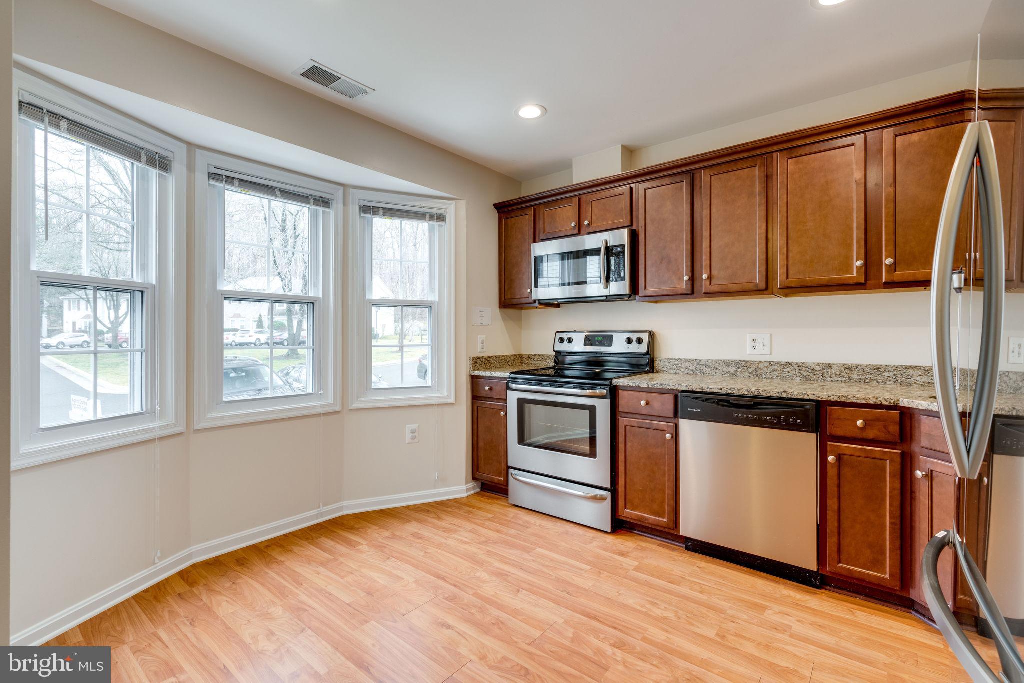 6032 Selwood Place Springfield, VA 22152 - Photo 4 of 42 Bright kitchen features bay window.