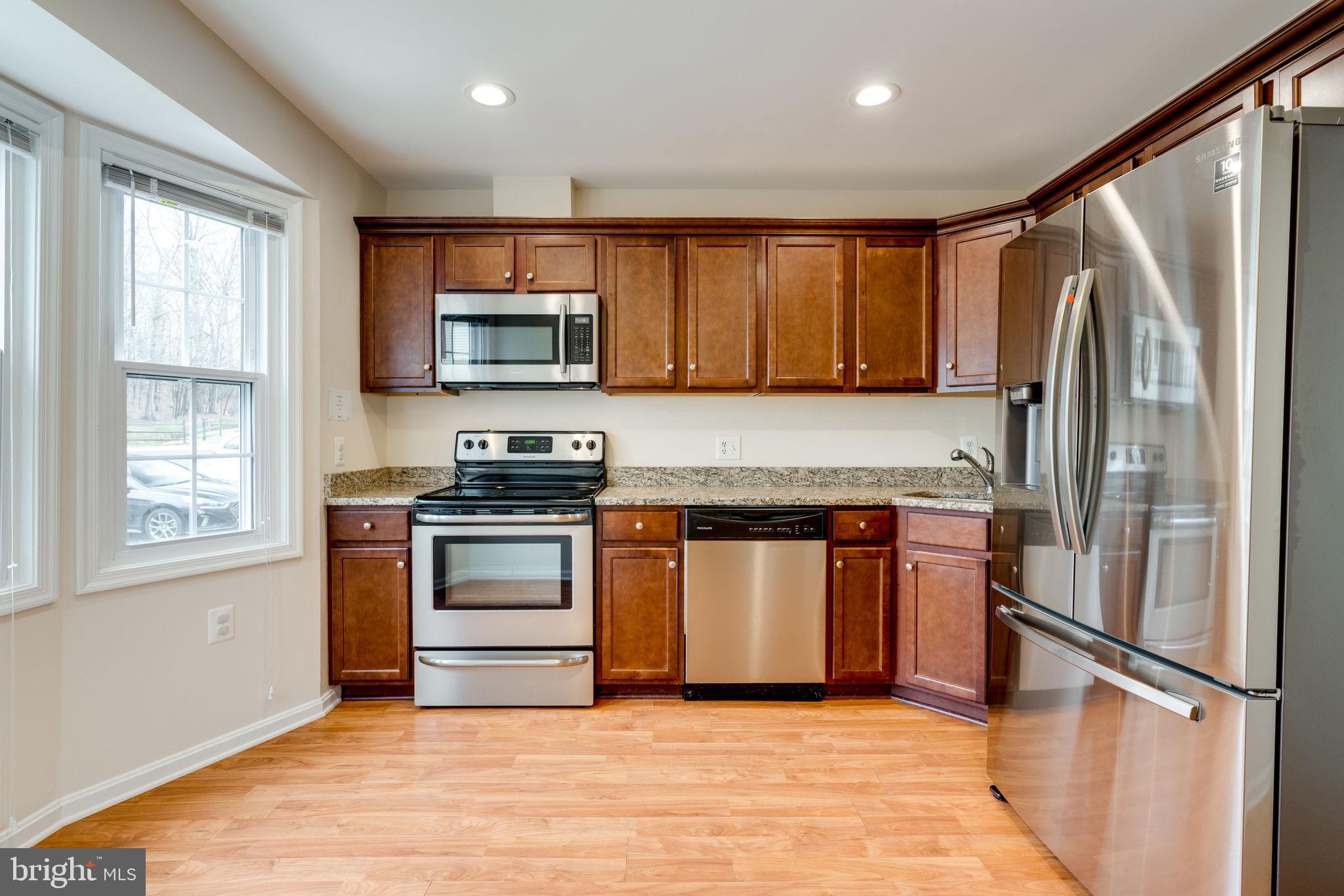 6032 Selwood Place Springfield, VA 22152 - Photo 6 of 42 2016 electric stove, microwave and dishwasher.
