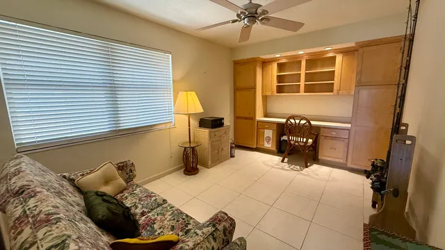 a bed room with a bed and a window