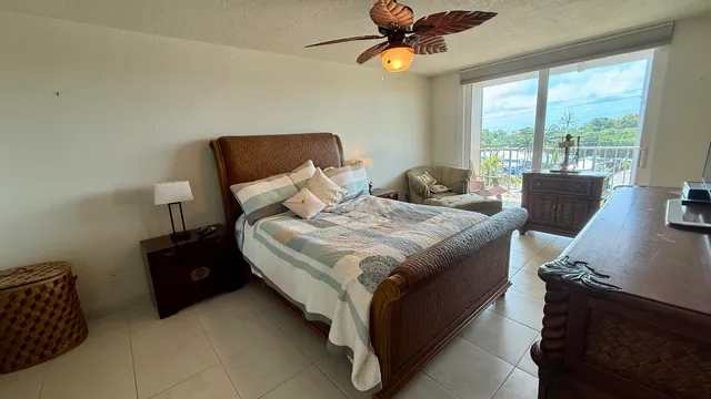 a bedroom with a bed and a desk