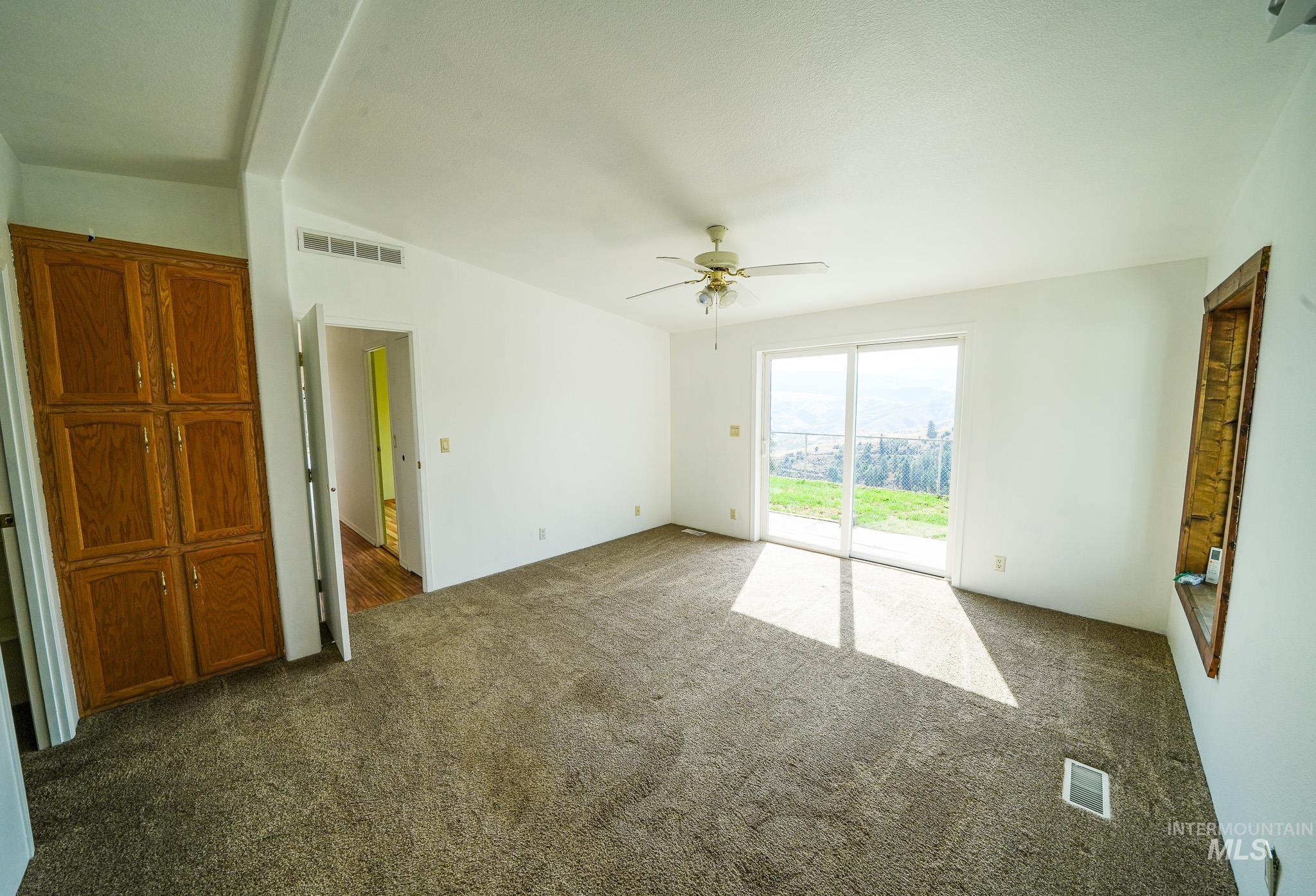 161 Saddle Ridge Road White Bird, ID 83554 - Photo 35 of 49 Wood-finish flooring with a ceiling fan light fixture