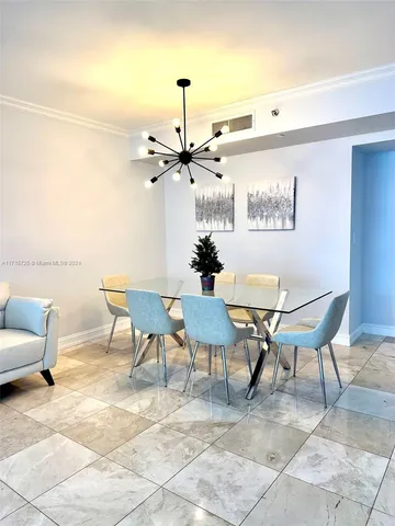 a view of a livingroom with furniture and a flat screen tv