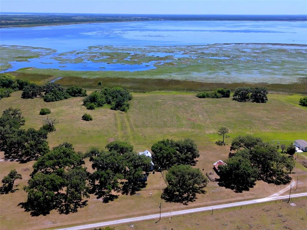 3650 Lake Tohopekaliga Road St. Cloud, FL 34772 - Photo 1 of 61 a view of a lake with a mountain view