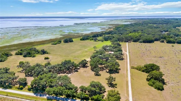 a view of a golf course with a lake