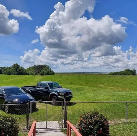a view of balcony with wooden floor