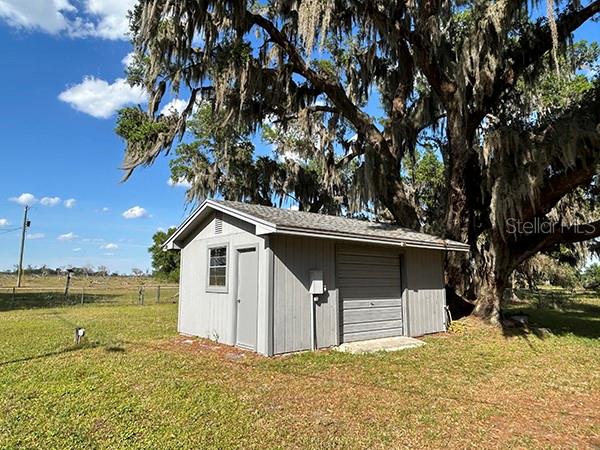 3650 Lake Tohopekaliga Road St. Cloud, FL 34772 - Photo 44 of 61 a front view of a house with a yard