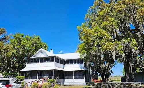 a front view of a house with garden