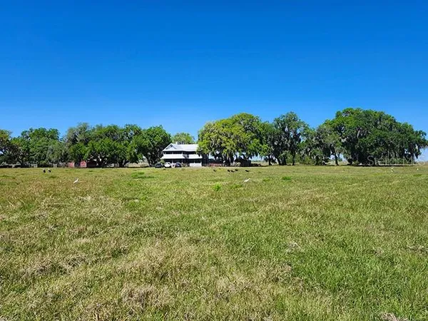 a view of a field with an outdoor space