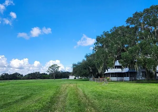 a front view of a house with a yard table and chairs