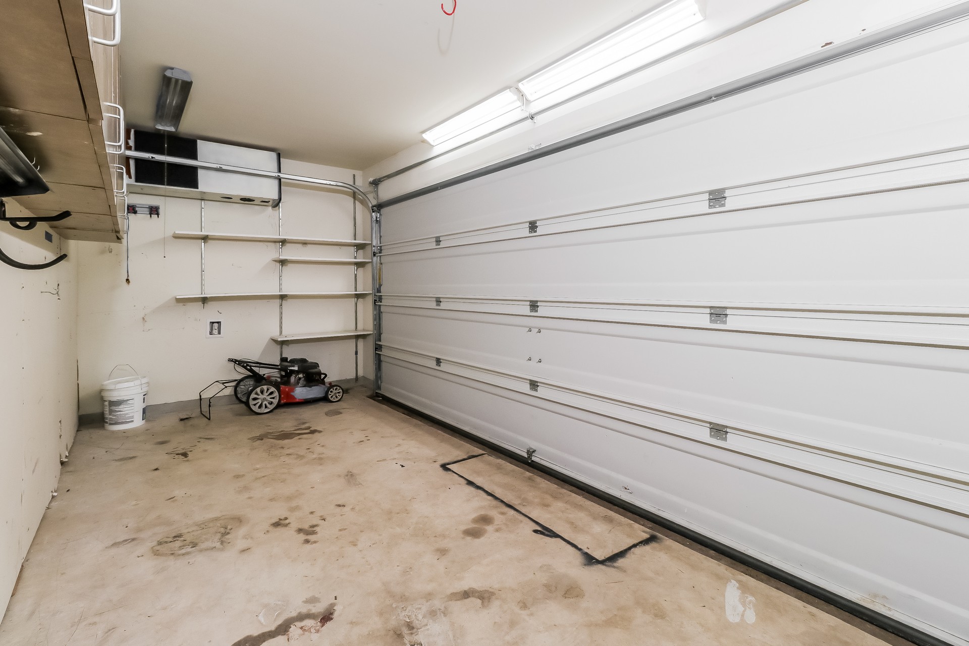 20017 Hubert R Humphrey Road Manor, TX 78653 - Photo 23 of 27 Functional garage with ample vertical storage solutions and concrete flooring.