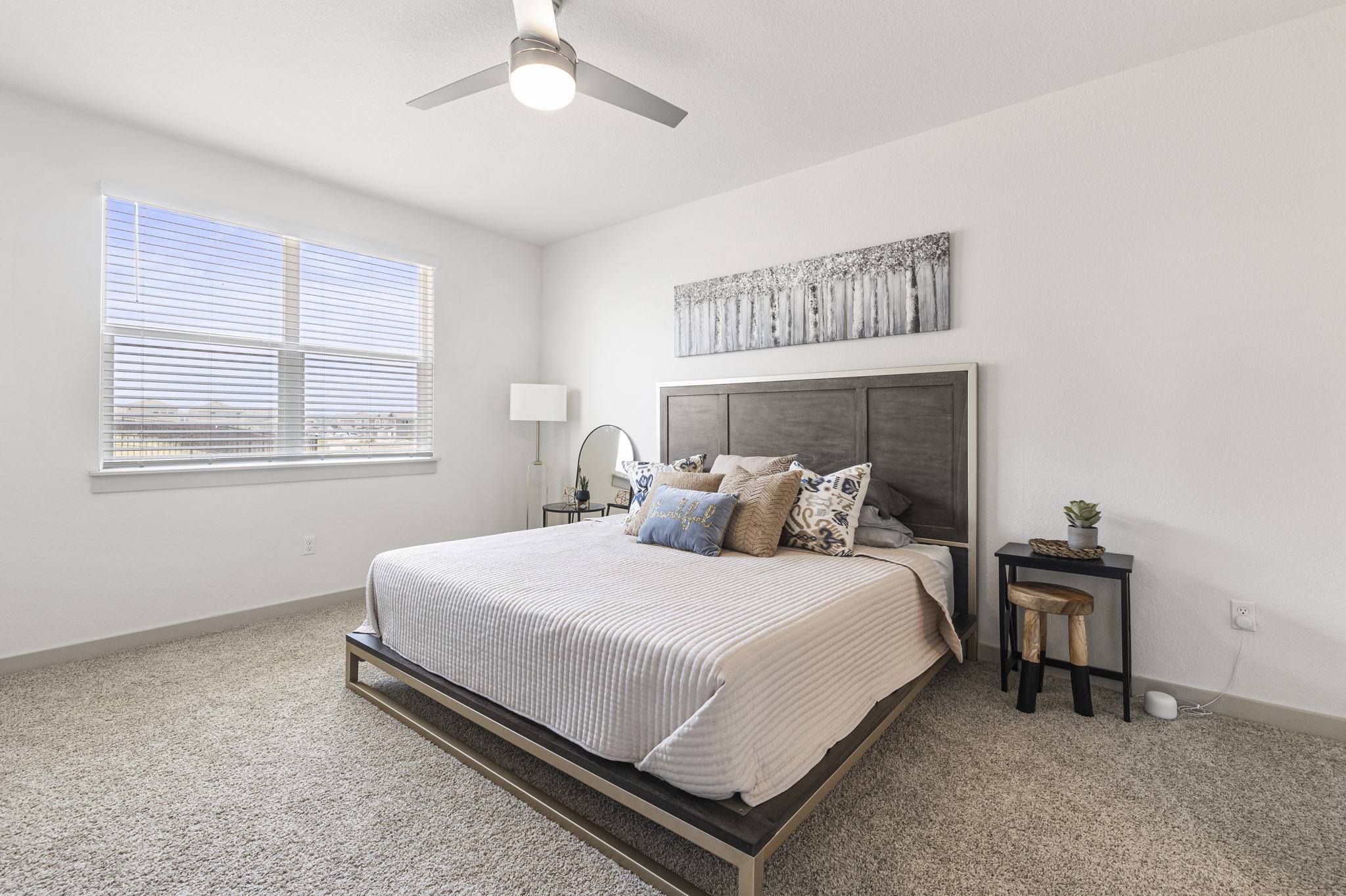 201 Merrick Road Georgetown, TX 78628 - Photo 8 of 20 a bedroom with a bed and a table in it