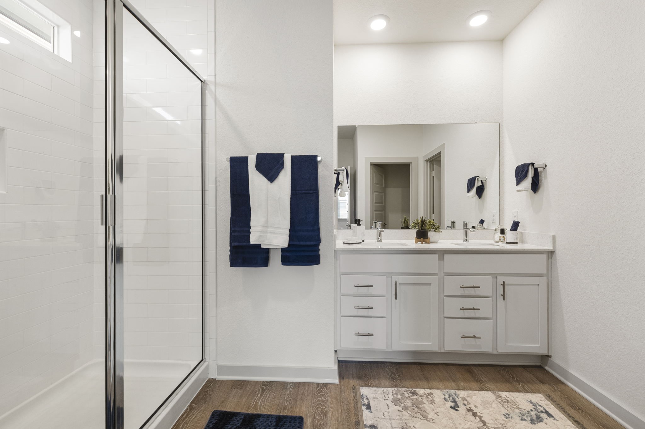 201 Merrick Road Georgetown, TX 78628 - Photo 9 of 20 a bathroom with a double vanity sink mirror and shower