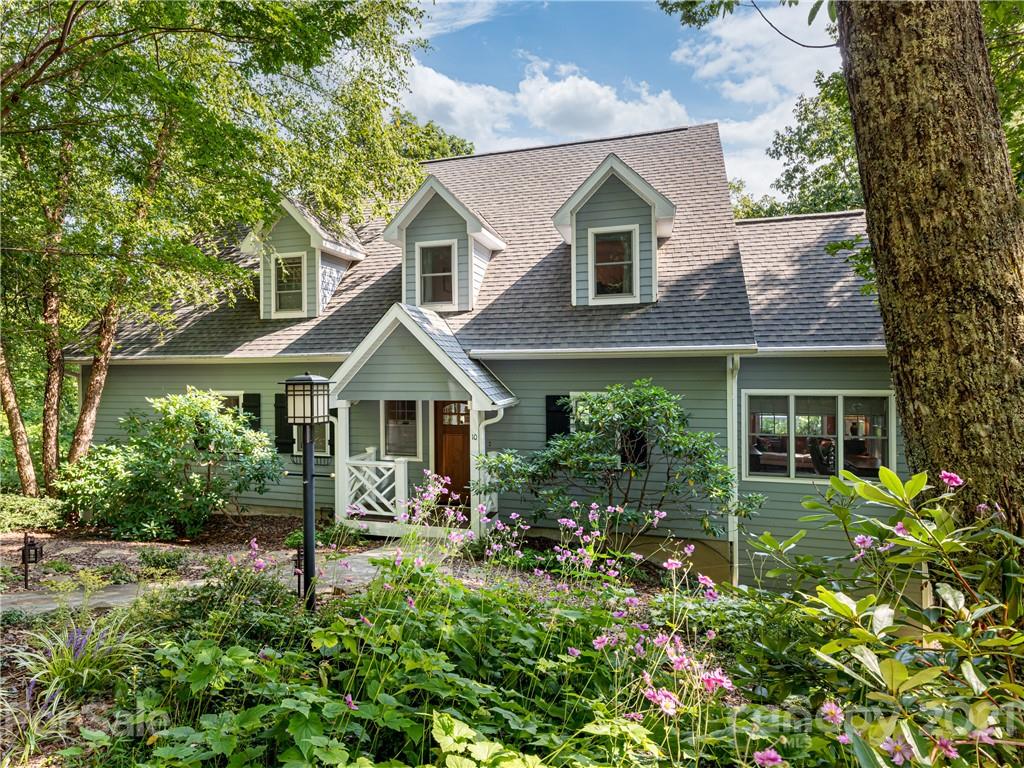 10 Powder Ridge Drive Asheville, NC 28803 - Photo 1 of 46 a front view of a house with garden