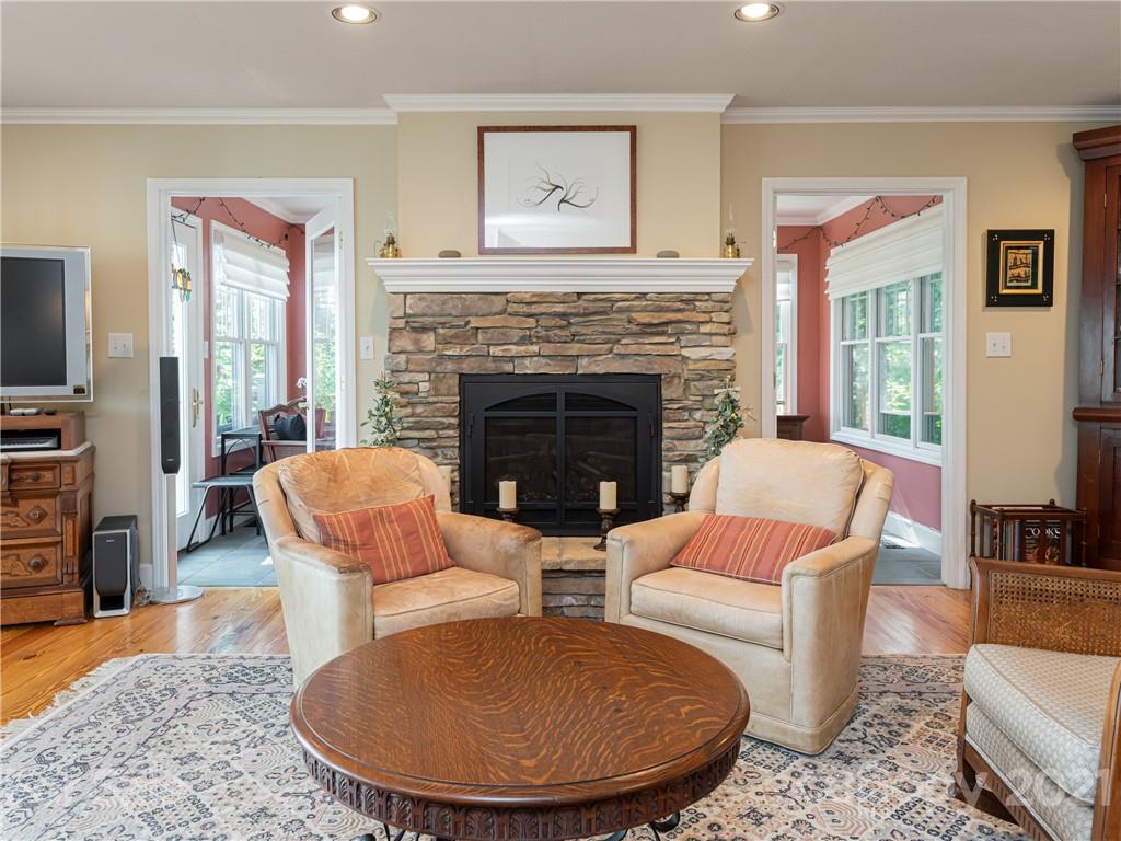 10 Powder Ridge Drive Asheville, NC 28803 - Photo 11 of 46 a living room with furniture a flat screen tv and a fireplace