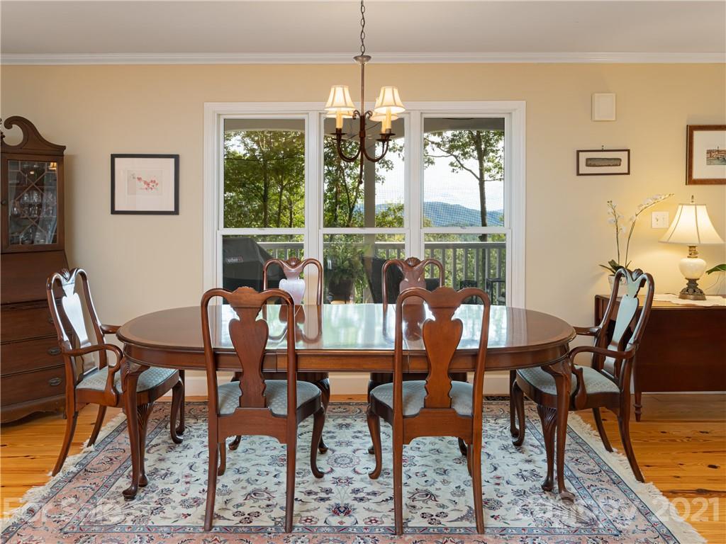 10 Powder Ridge Drive Asheville, NC 28803 - Photo 14 of 46 a dining room with furniture a chandelier and window