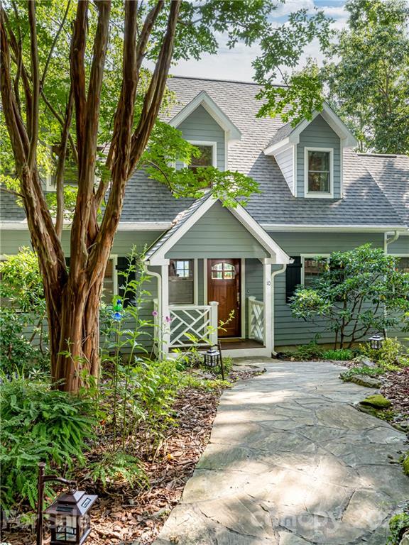 10 Powder Ridge Drive Asheville, NC 28803 - Photo 3 of 46 a front view of a house with a yard and potted plants