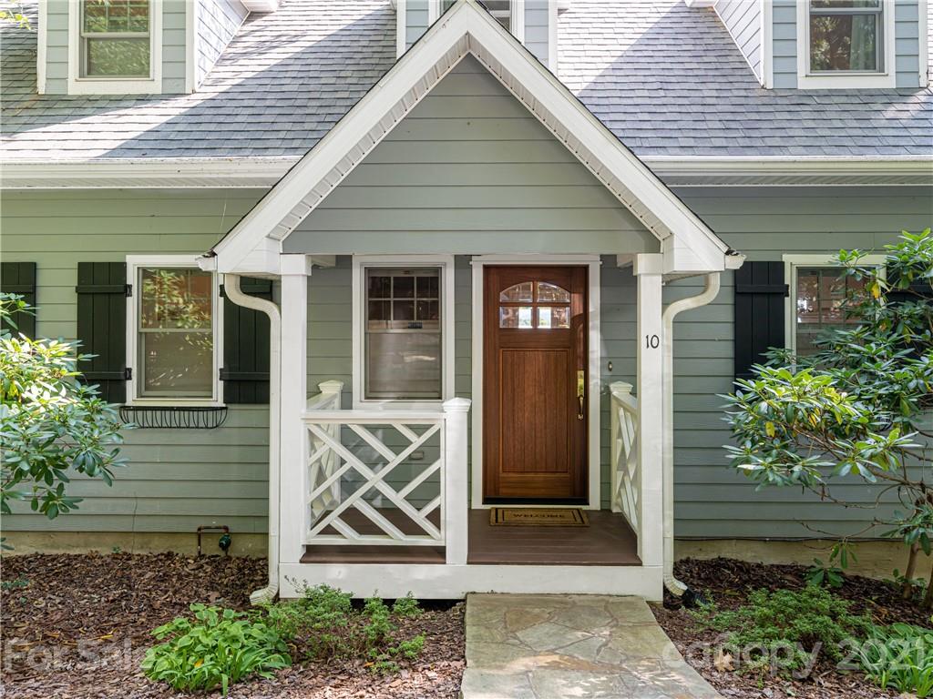 10 Powder Ridge Drive Asheville, NC 28803 - Photo 4 of 46 a front view of a house with garden