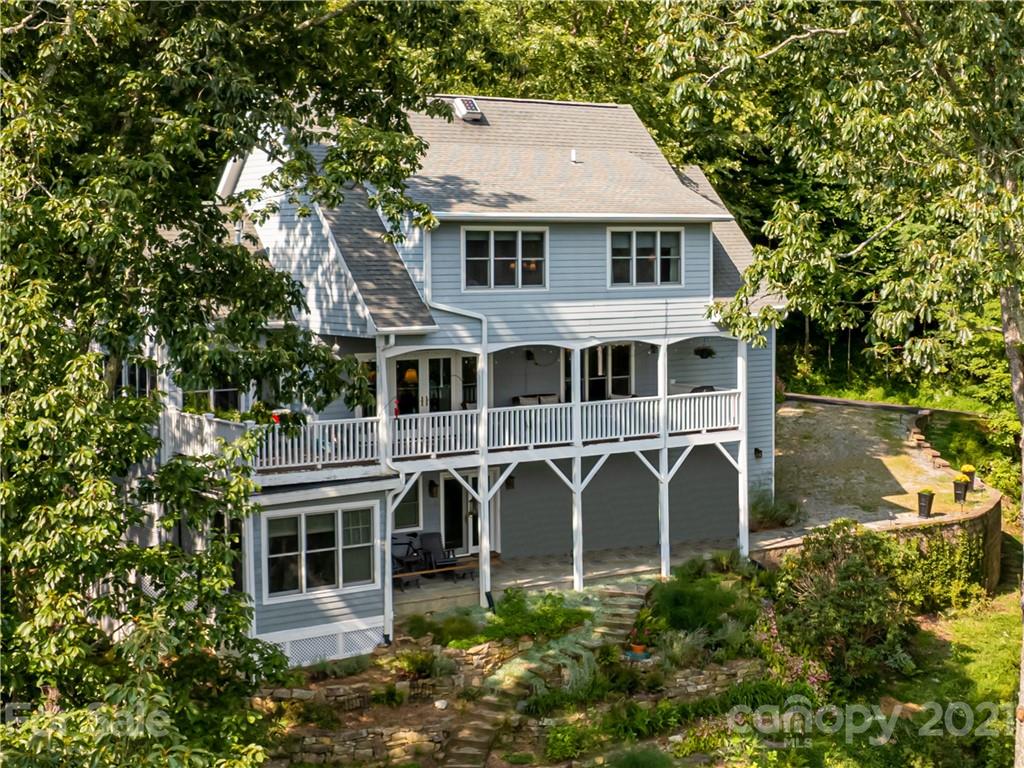 10 Powder Ridge Drive Asheville, NC 28803 - Photo 46 of 46 a big house with large windows and trees