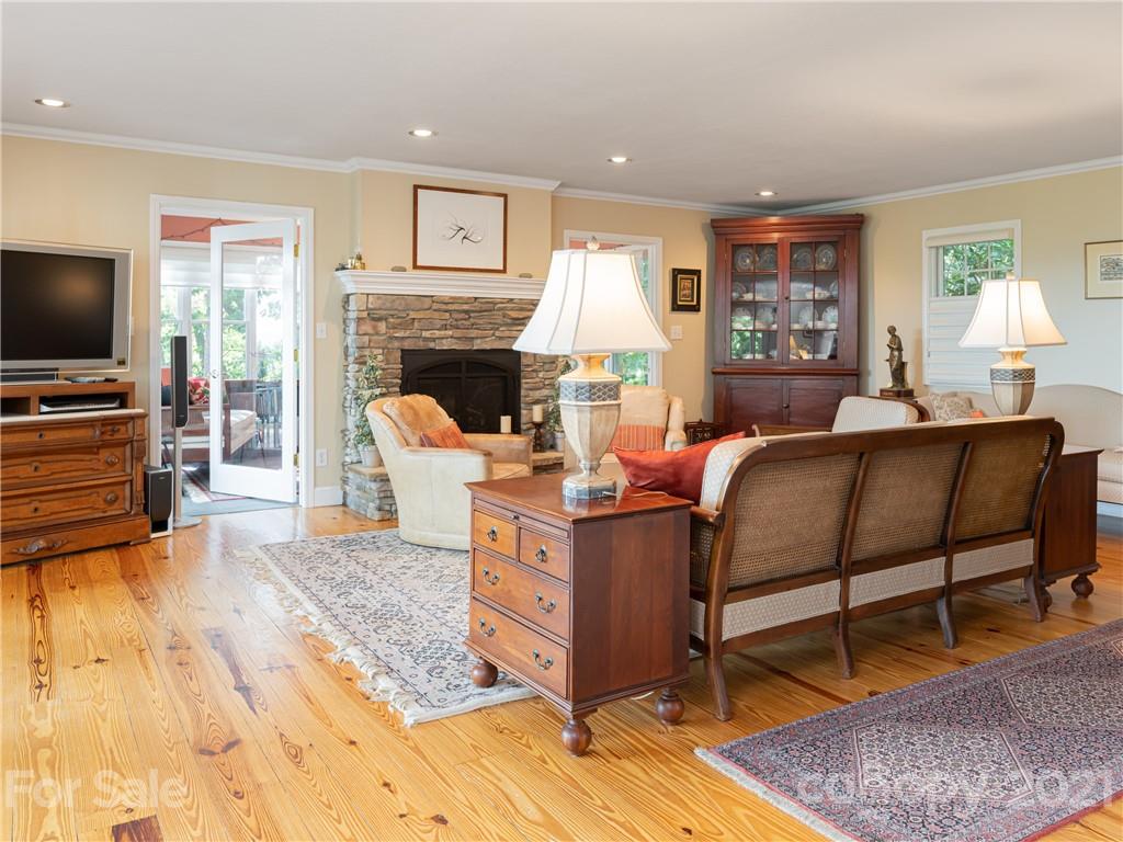 10 Powder Ridge Drive Asheville, NC 28803 - Photo 8 of 46 a living room with furniture a flat screen tv and a fireplace