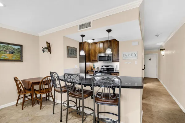 a view of a dining room with furniture
