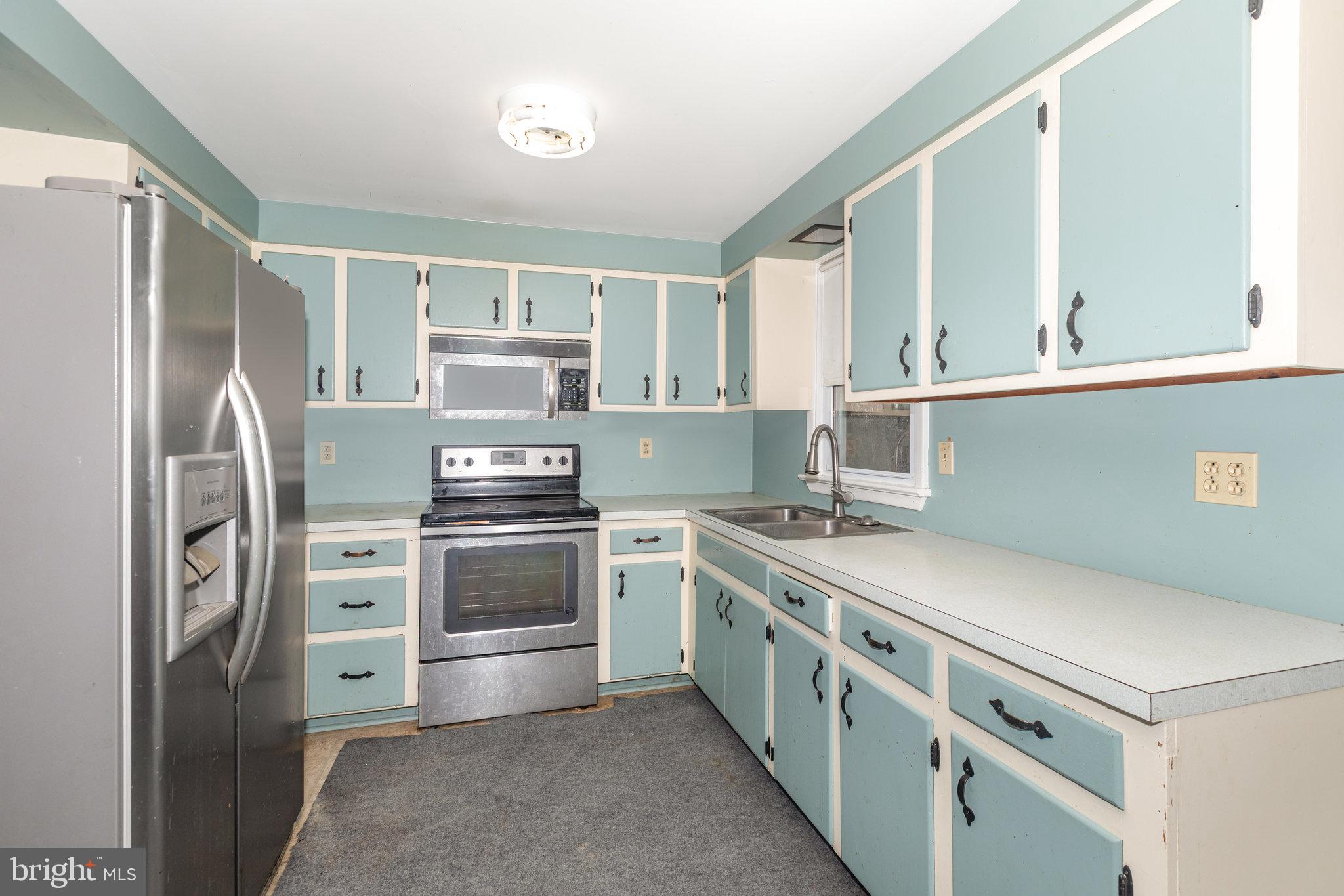 93 Beard Road Enola, PA 17025 - Photo 7 of 31 a kitchen with stainless steel appliances a stove and a refrigerator