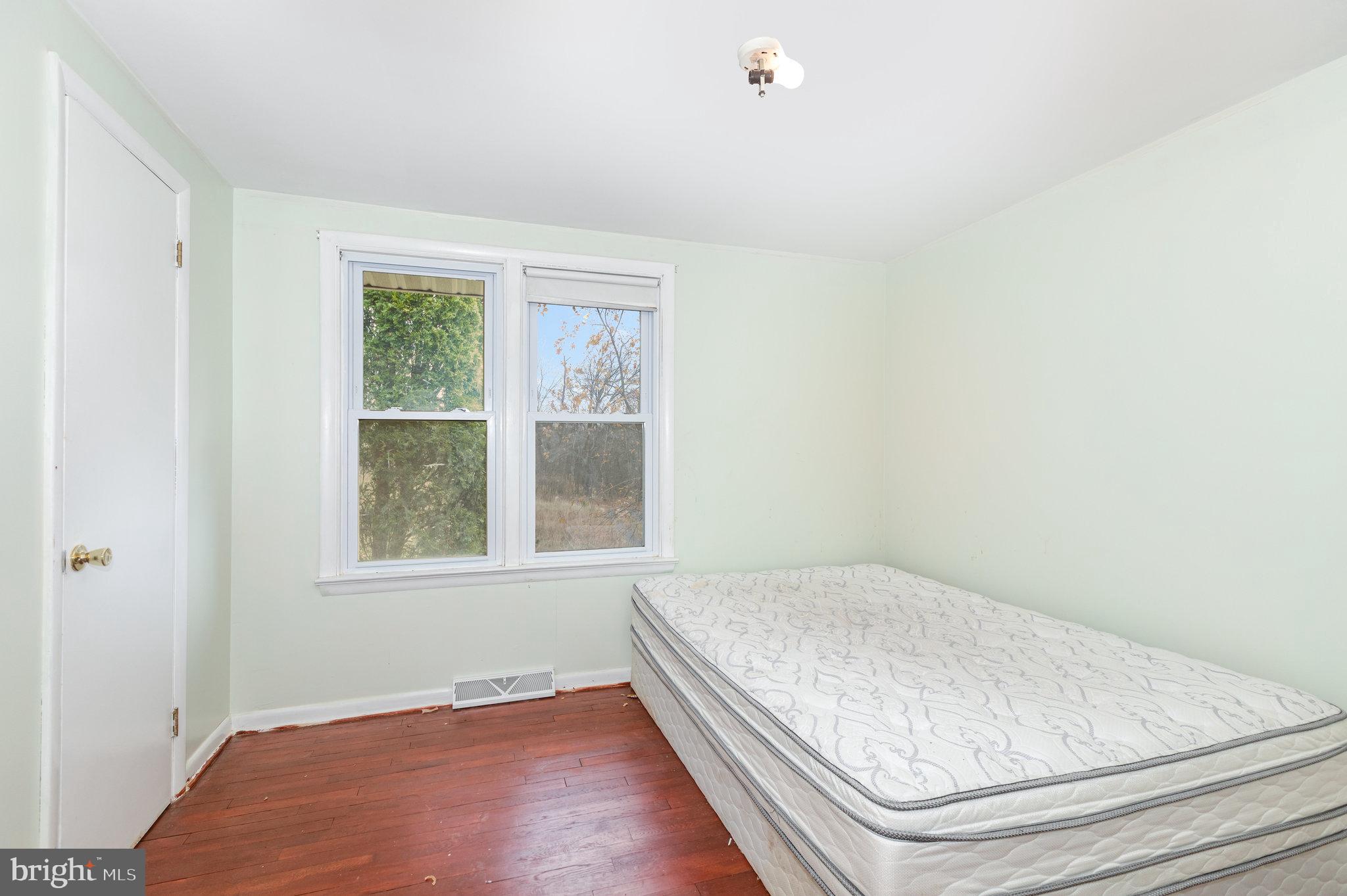 93 Beard Road Enola, PA 17025 - Photo 10 of 31 an empty room with wooden floor and windows