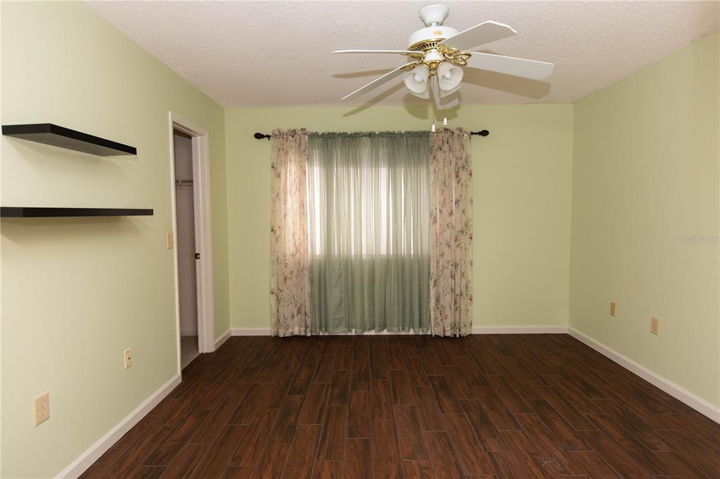 9410 Nakoma Way, Unit H Weeki Wachee, FL 34613 - Photo 17 of 29 a view of entryway with wooden floor