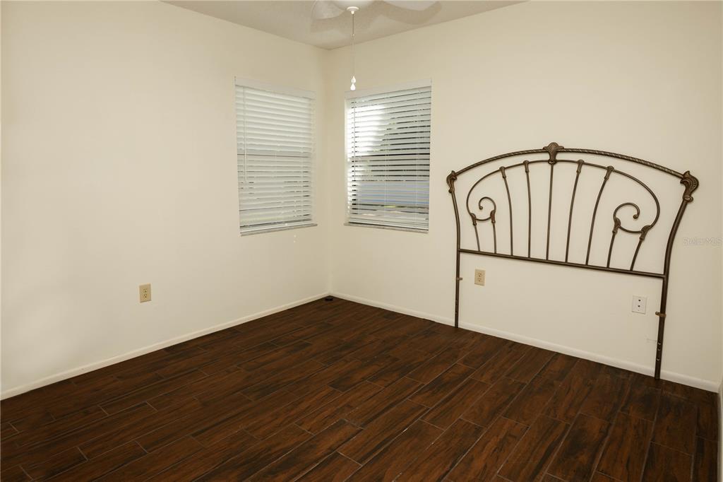 9410 Nakoma Way, Unit H Weeki Wachee, FL 34613 - Photo 22 of 29 a view of entryway with wooden floor